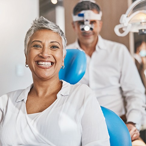 Closeup of patient smiling in treatment chair